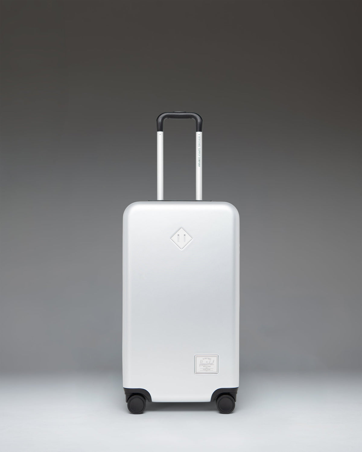 Herschel Heritage Hardshell Medium Luggage 67L in Silver — front view # color_Silver