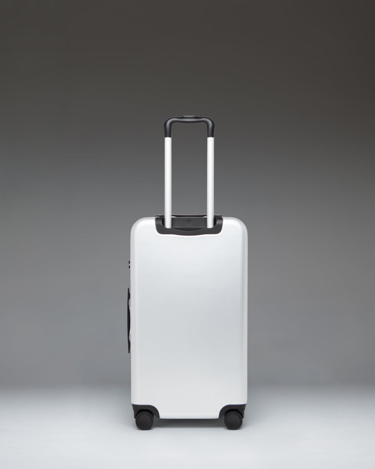 Herschel Heritage Hardshell Medium Luggage 67L in Silver — back view