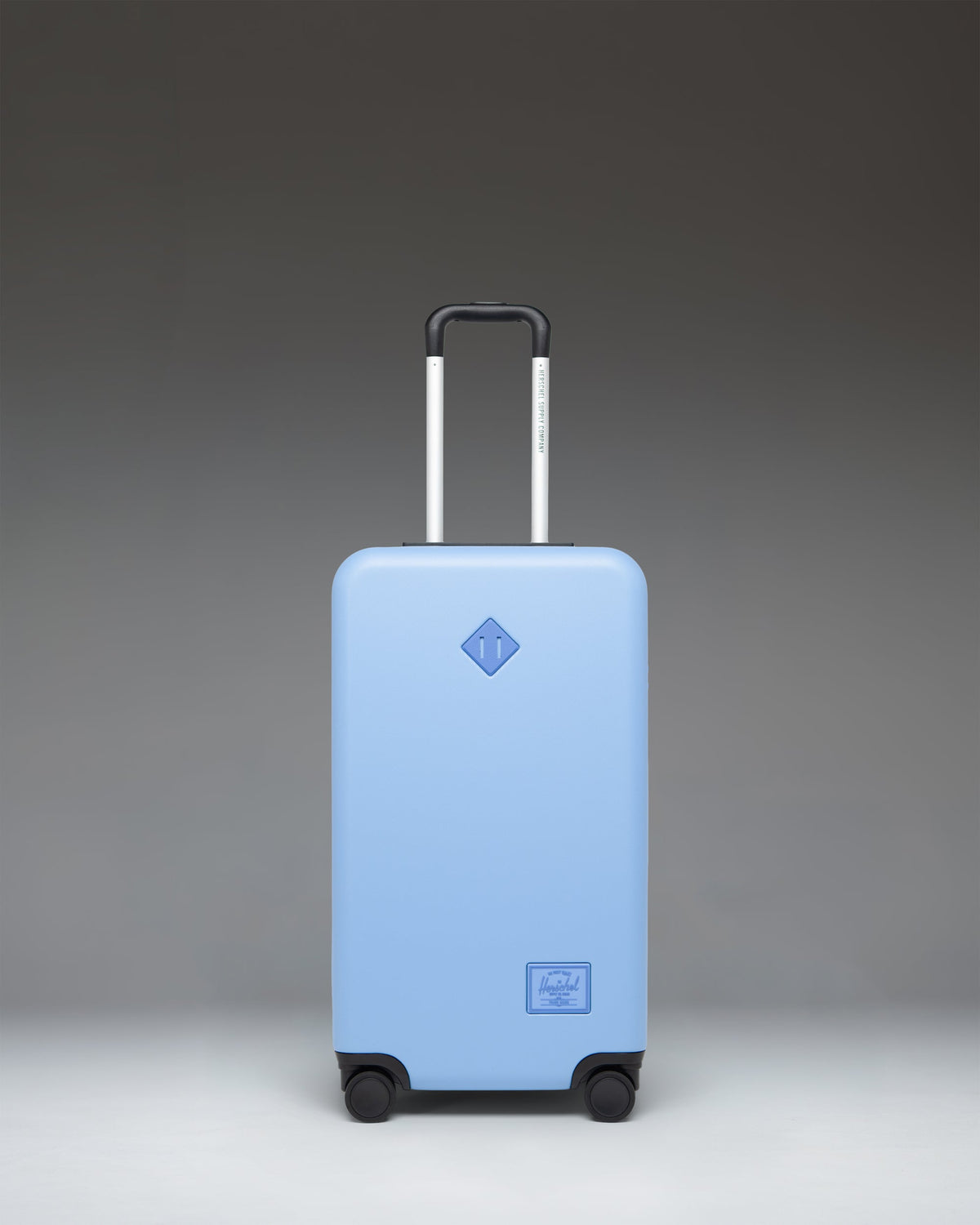 Herschel Heritage Hardshell Medium Luggage 67L in Light Blue — front view