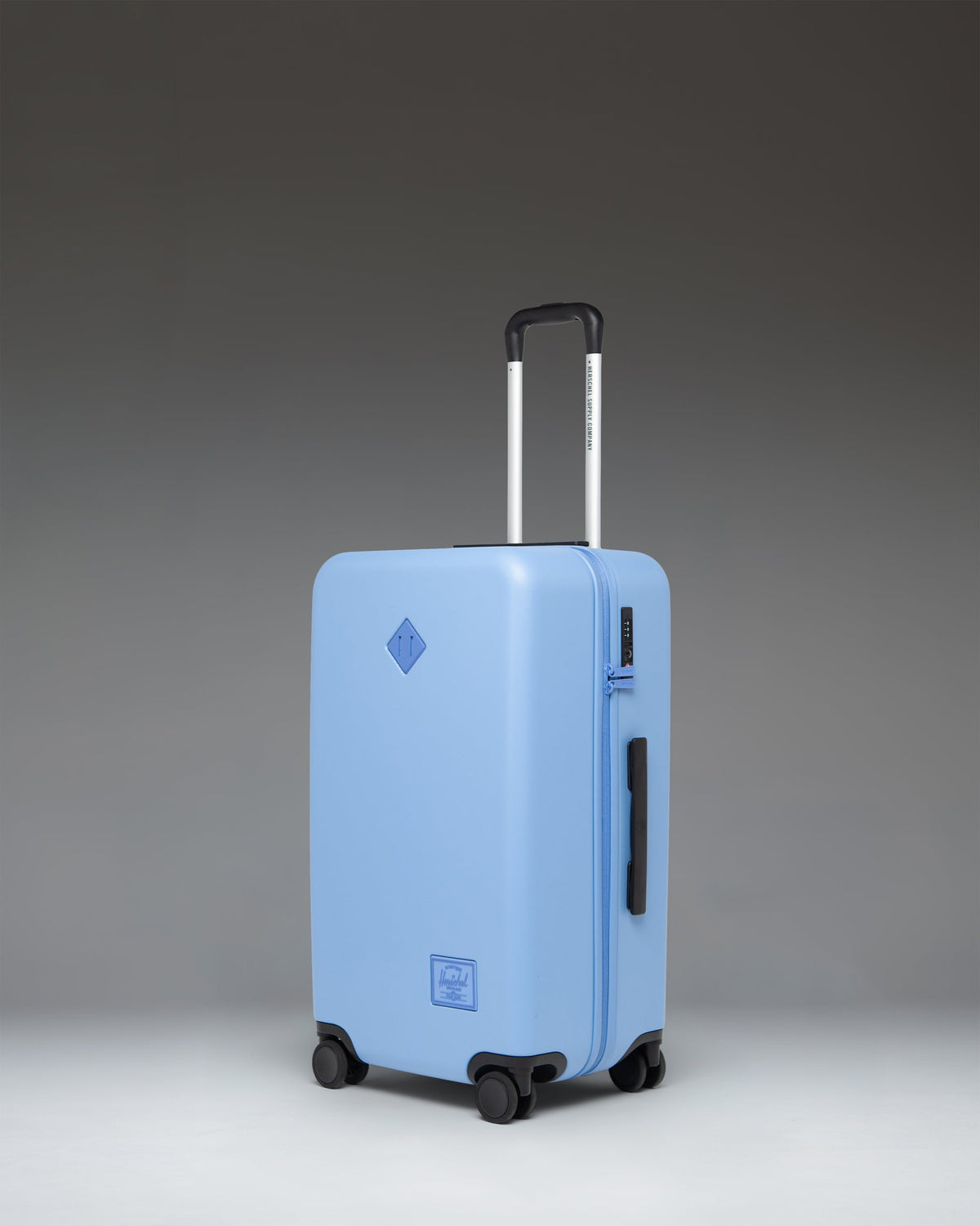 Herschel Heritage Hardshell Medium Luggage 67L in Light Blue — angle view
