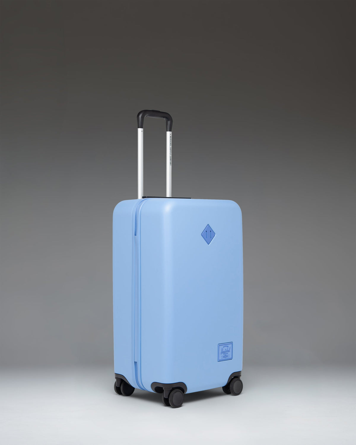 Herschel Heritage Hardshell Medium Luggage 67L in Light Blue — angle view 2