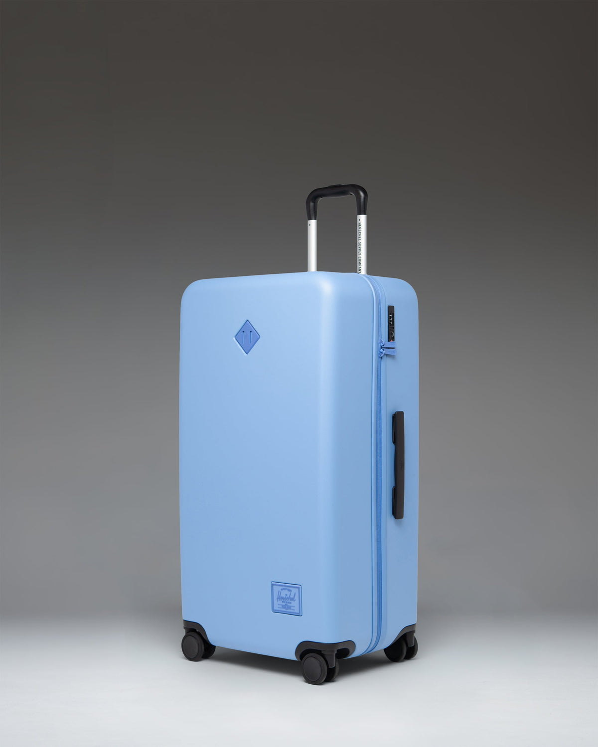 Herschel Heritage Hardshell Large Luggage 95L in Light Blue — angle view