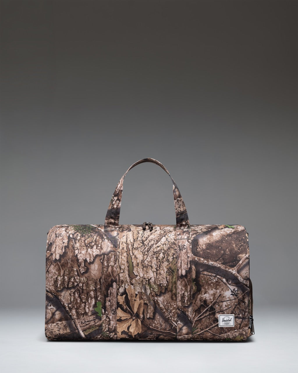 Realtree Herschel Novel Duffle 43L in Realtree APX™ Camo — front view