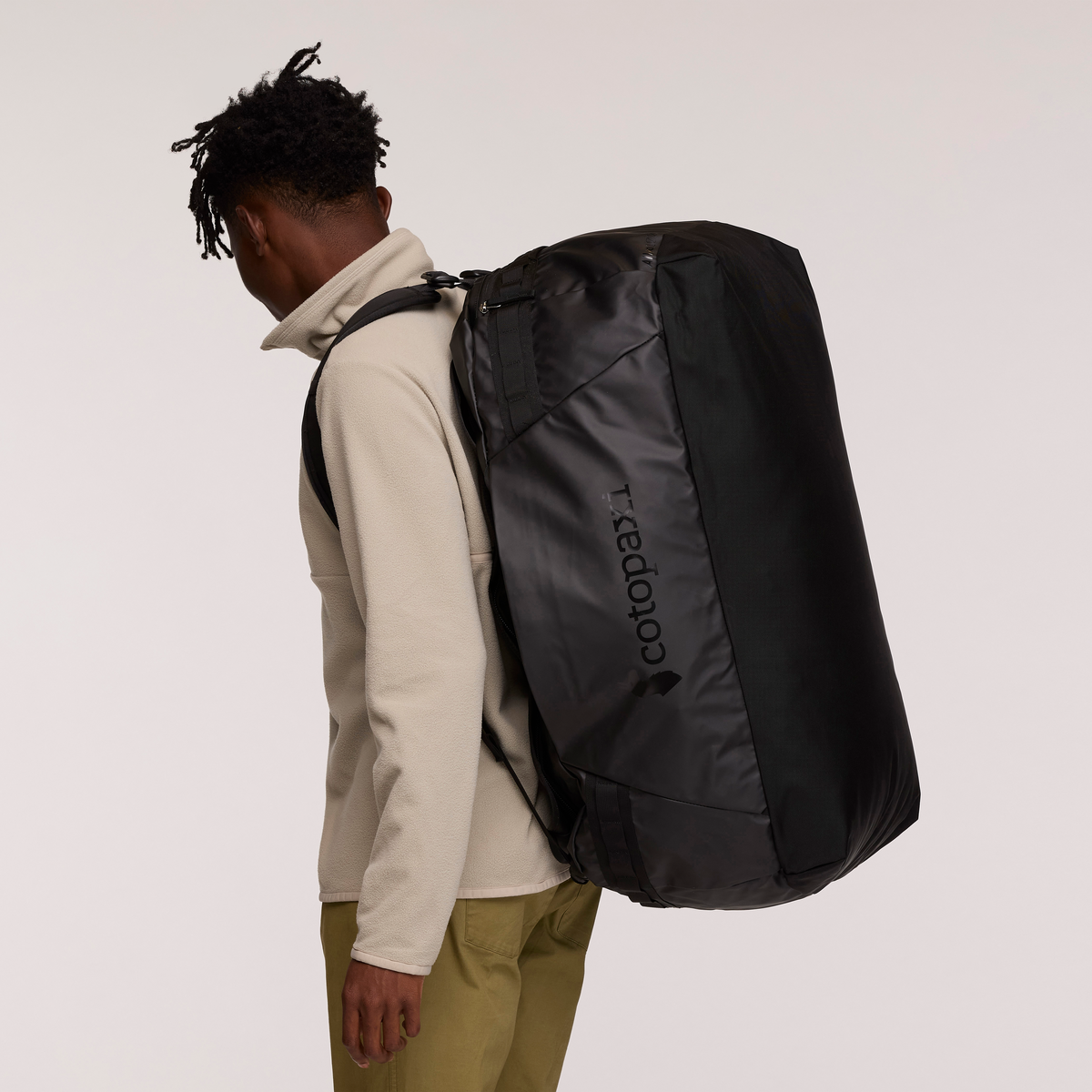 Cotopaxi Allpa Getaway 100L Duffel in Black — lifestyle