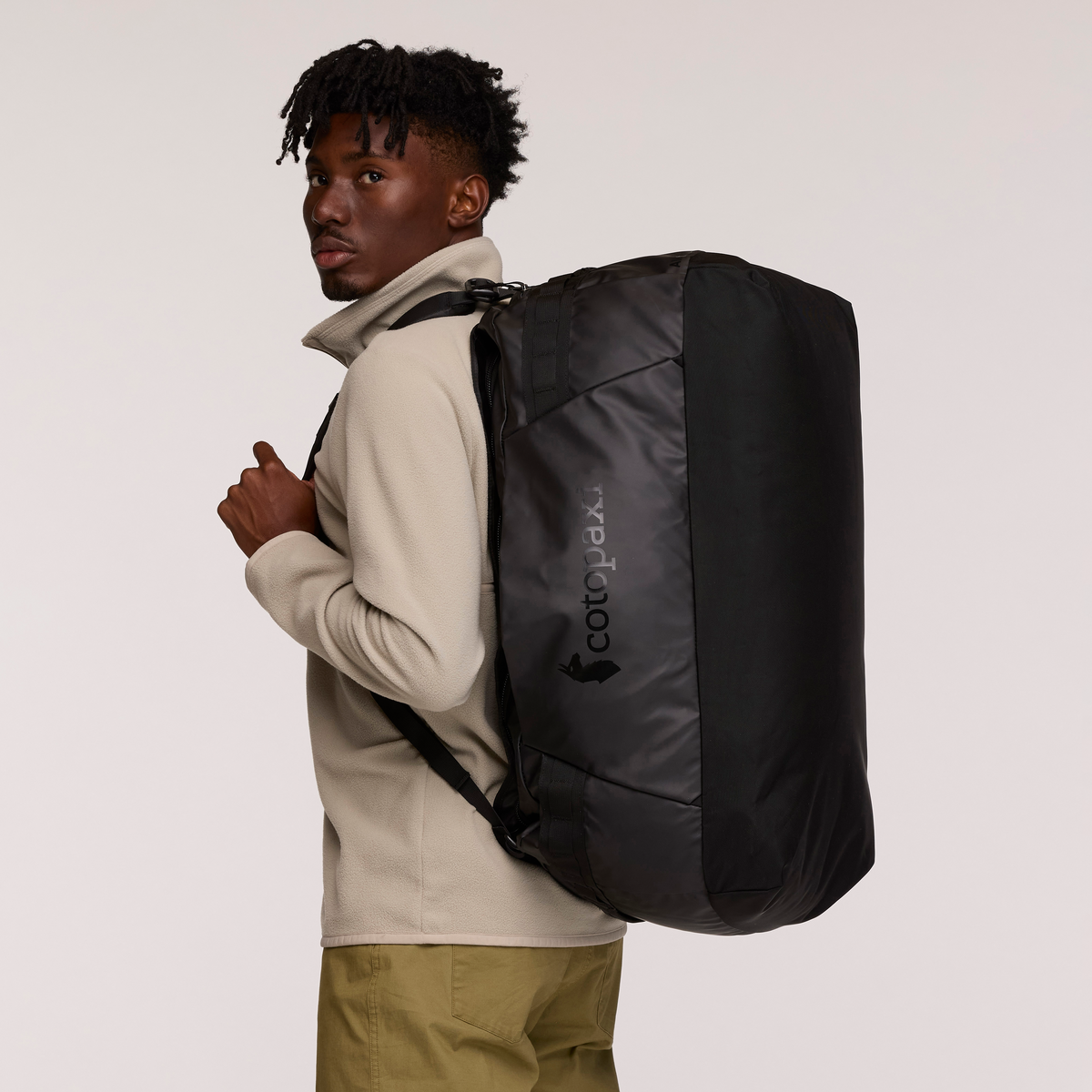 Cotopaxi Allpa Getaway 70L Duffel in Black — lifestyle