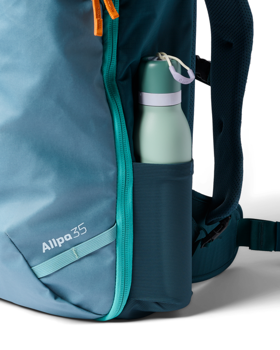 Cotopaxi Allpa 35L Travel Pack in Blue Spruce/Abyss — angle view 2