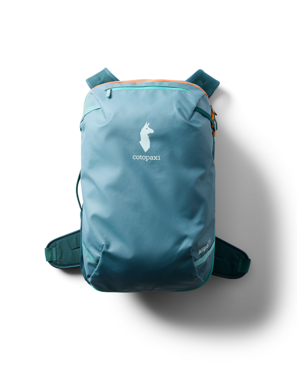 Cotopaxi Allpa 35L Travel Pack in Blue Spruce/Abyss — lifestyle view