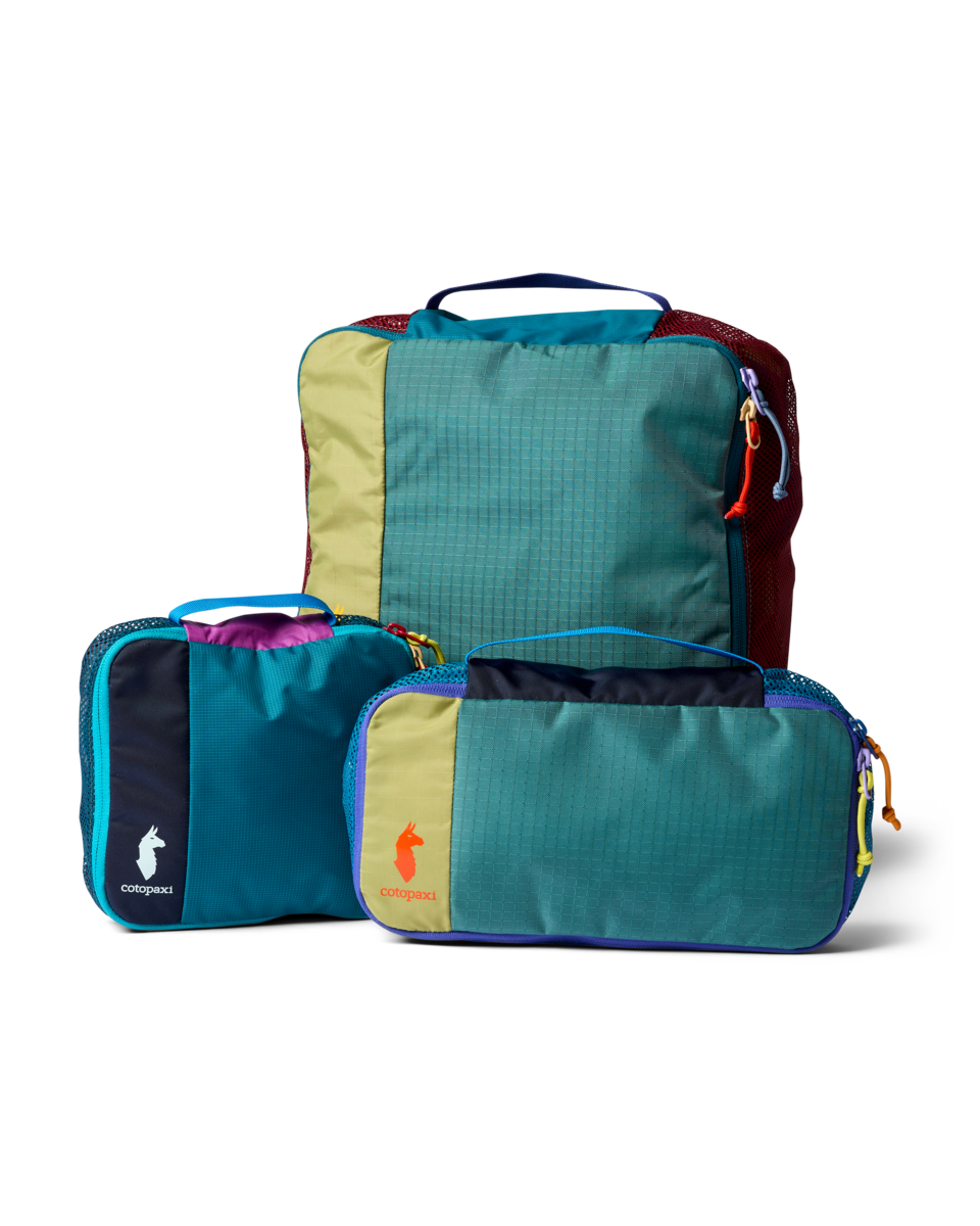 Cotopaxi Cubo Packing Travel Bundle in Del Día — front view