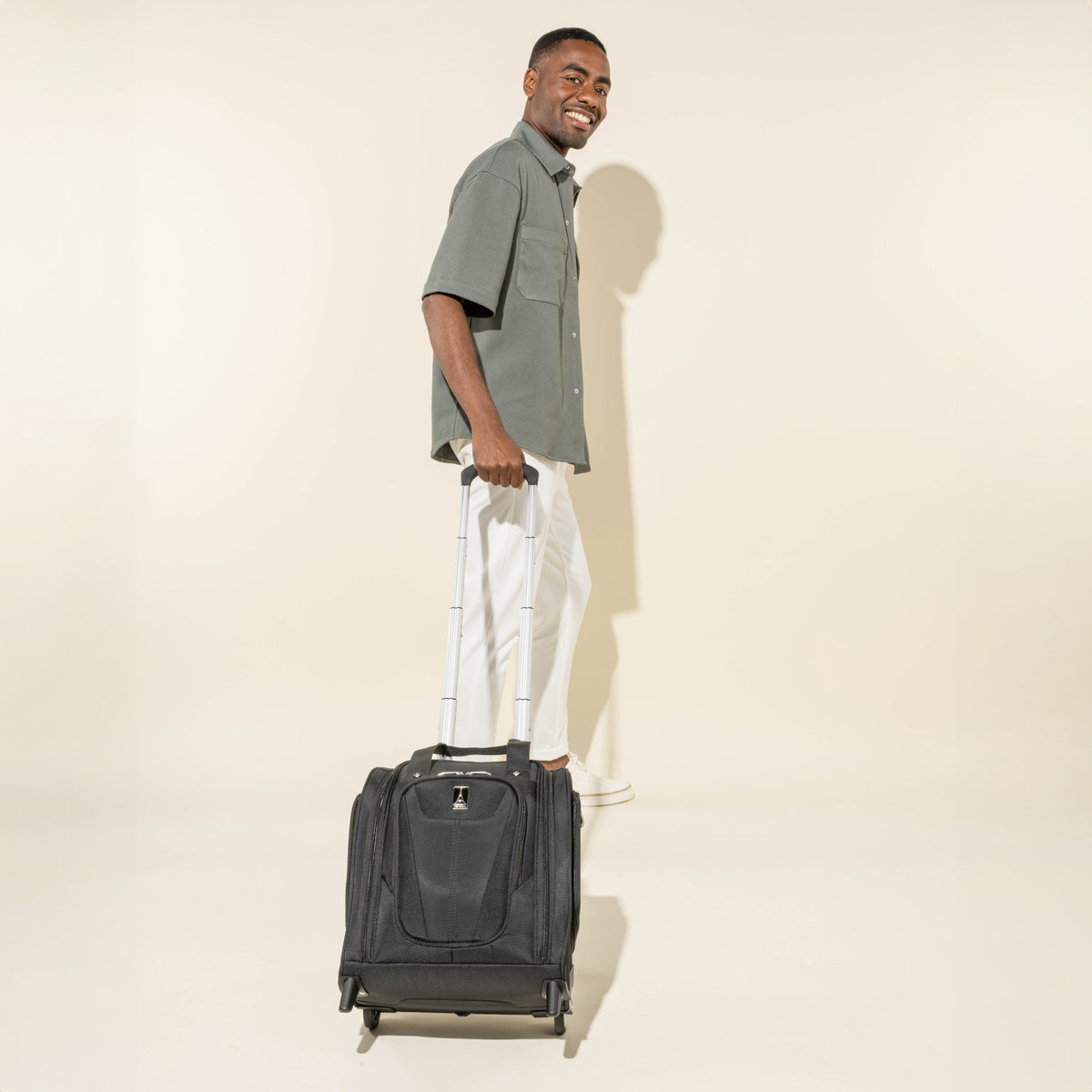 Travelpro Maxlite 5 Carry-On Rolling Underseat Bag in Black — lifestyle