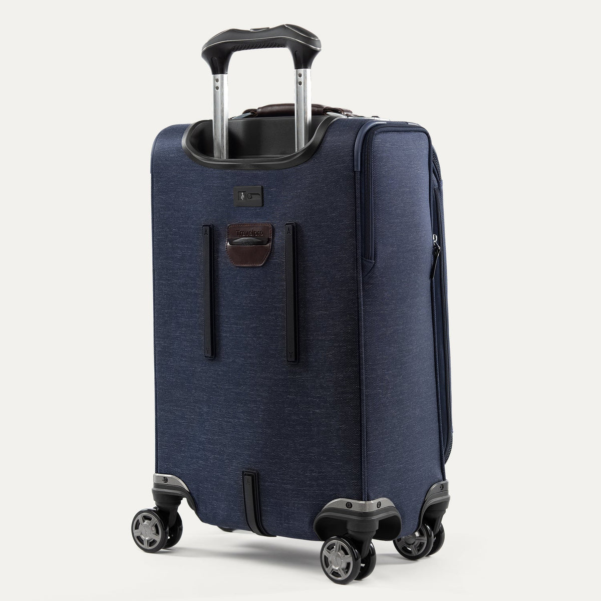 Travelpro Platinum Elite 21” Expandable Carry-On Spinner in True Navy — back view