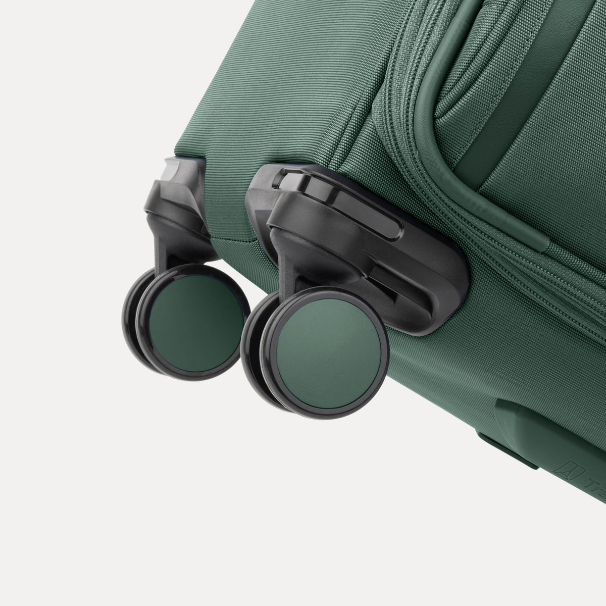 Travelpro VersaPack+ Medium Check-In Spinner in Desert Sage Green — detail view