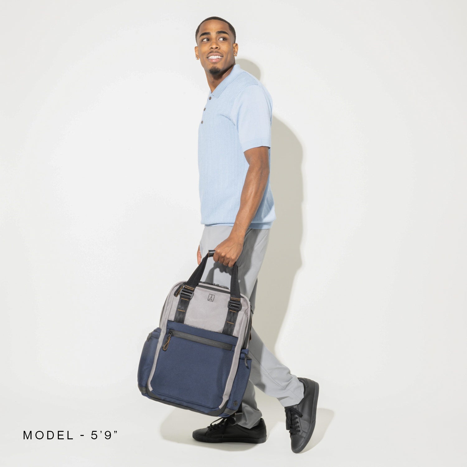 Travelpro Altitude Medium Expandable Laptop Backpack 25-30L in Aviator Navy — lifestyle view