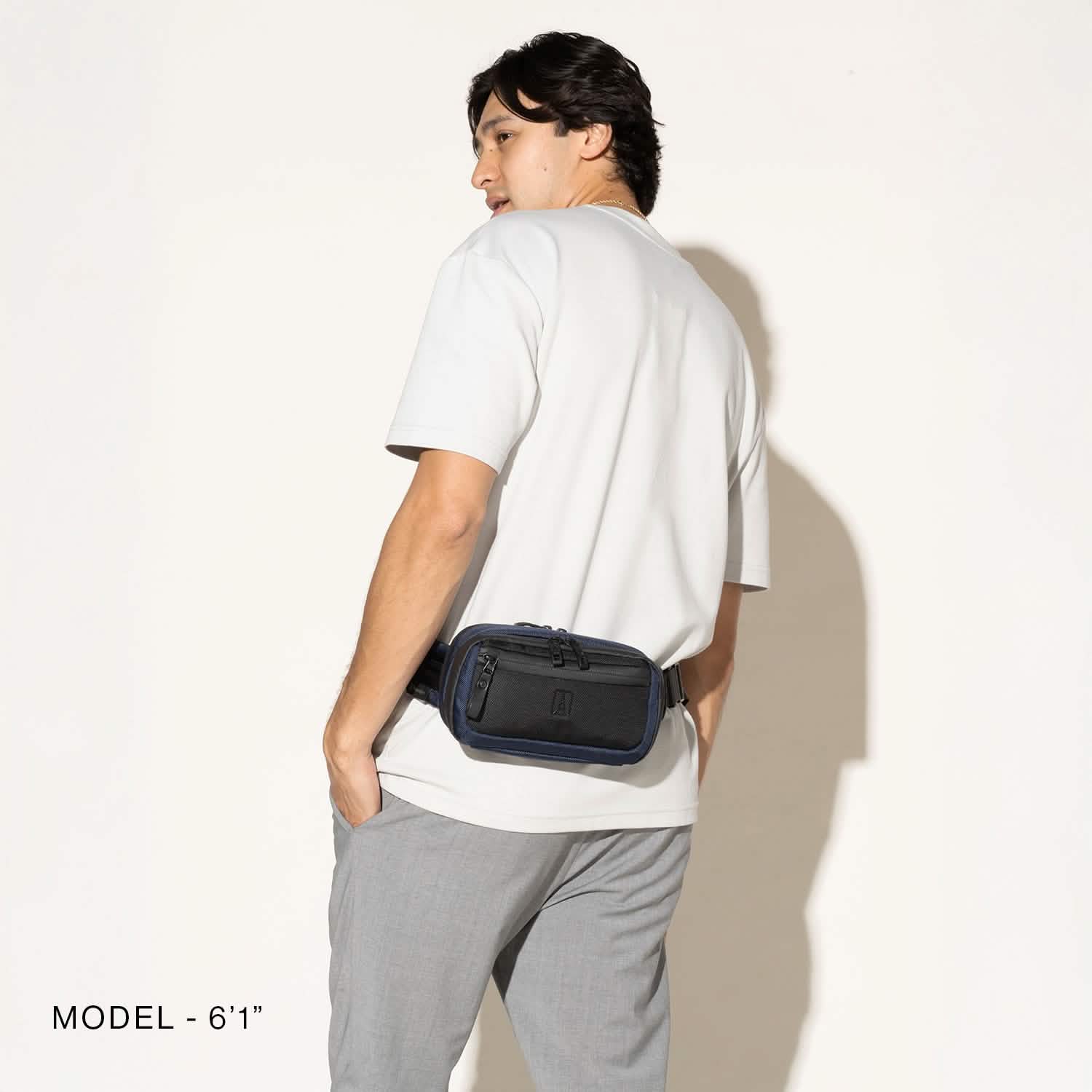 Travelpro Altitude Sling 2L in Aviator Navy — angle view 2