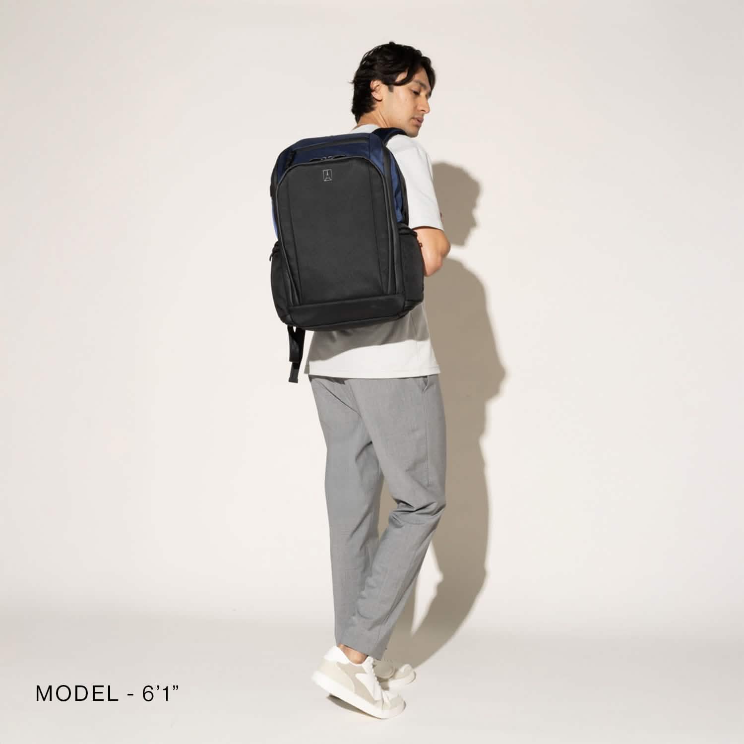 Travelpro Altitude All-Purpose Full Expansion Laptop Backpack 24-34L in Aviator Navy — lifestyle view