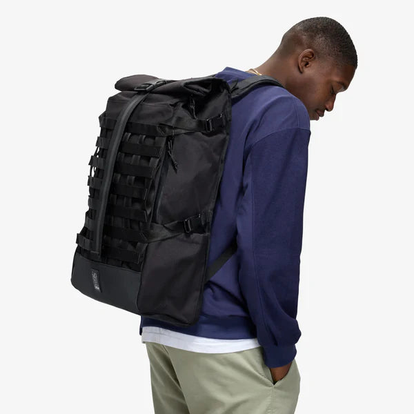 Chrome Industries Barrage 34L backpack – person wearing the backpack, front view