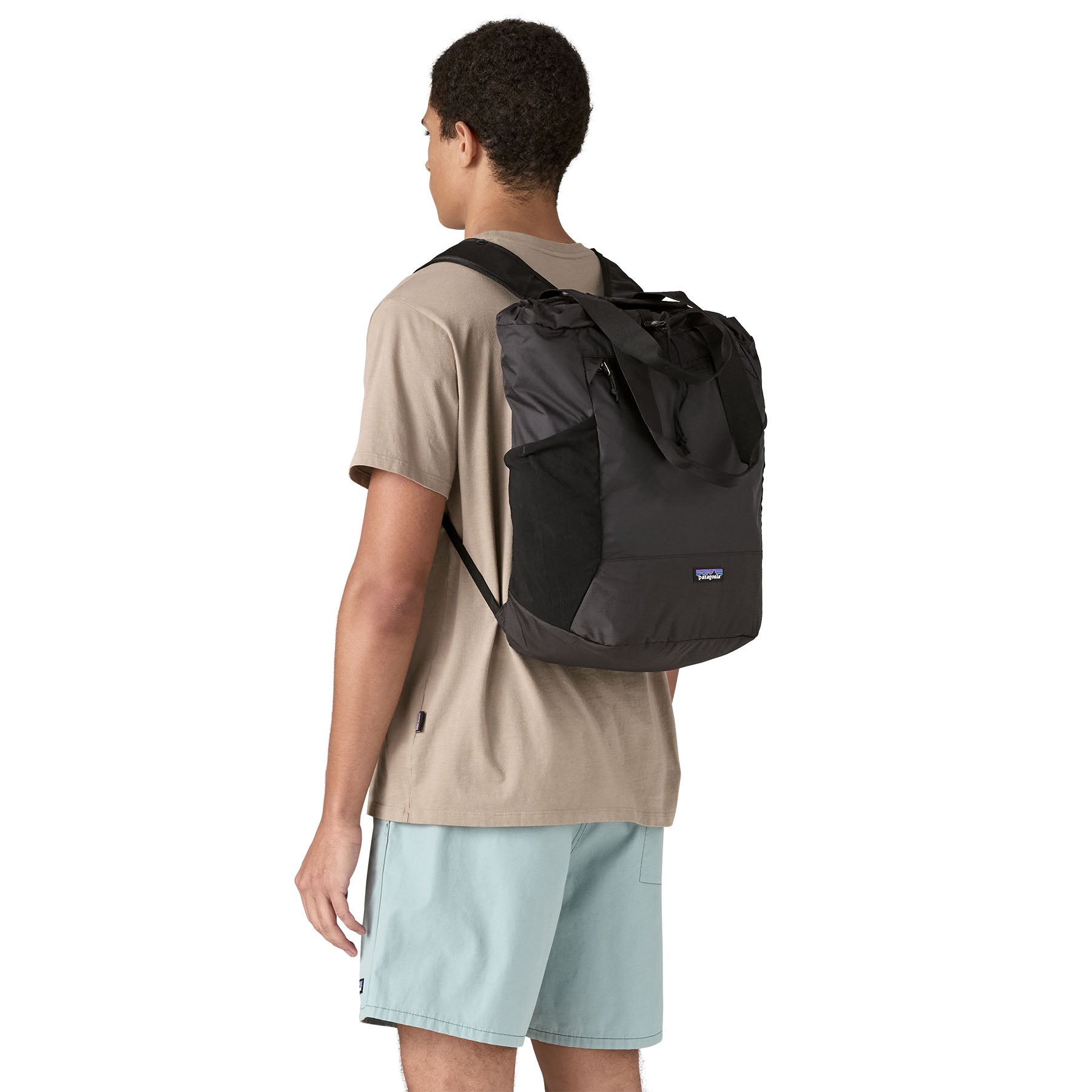 Patagonia Terravia Tote Pack 24L in Black — lifestyle