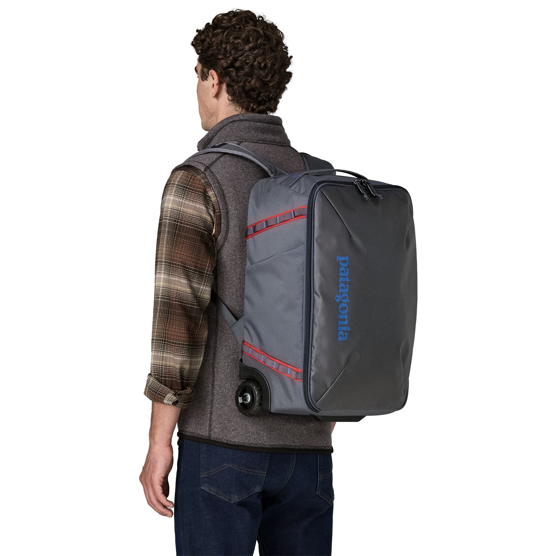 Patagonia Black Hole MLC Wheelie 34L in Smolder Blue/Amanita Red — lifestyle
