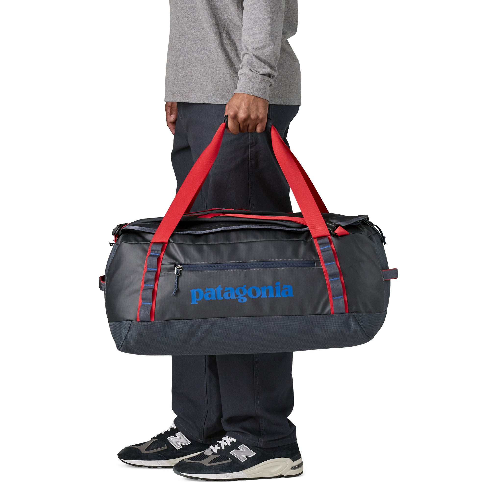 Patagonia Black Hole Duffel 55L in Smolder Blue/Amanita Red — angle view 1