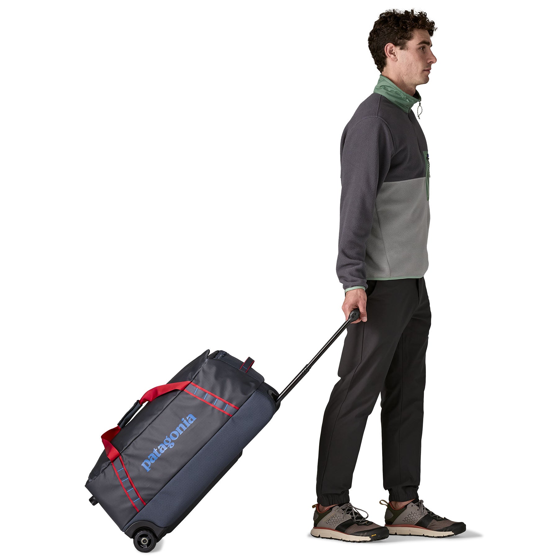 Patagonia Black Hole Wheeled Duffel 70L in Smolder Blue/Amanita Red — lifestyle