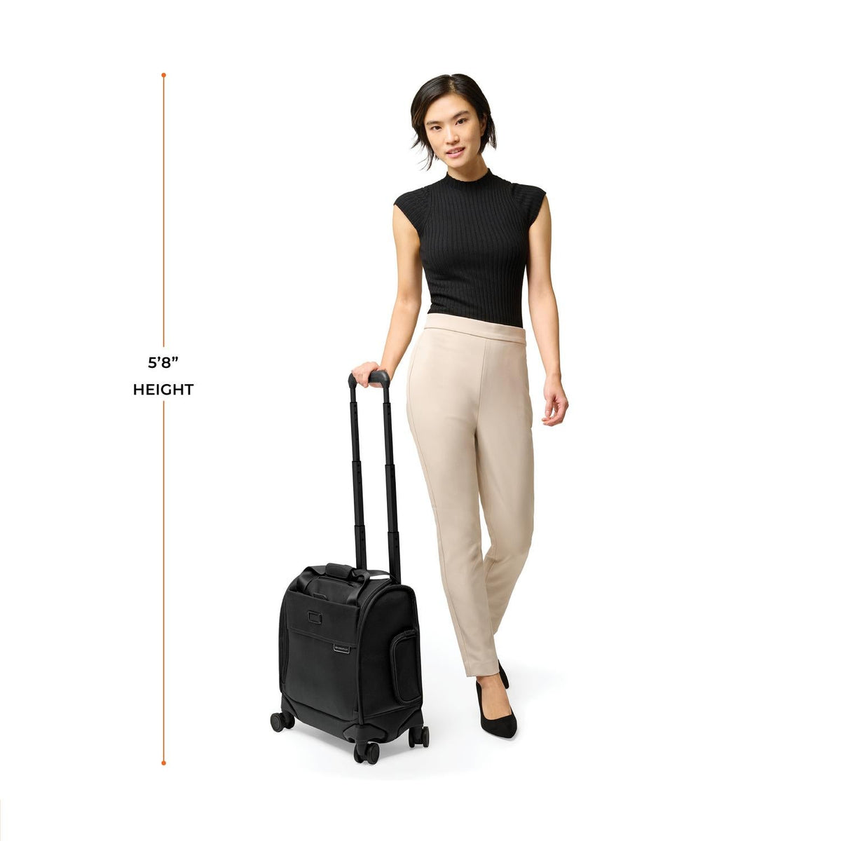 Briggs & Riley Baseline Cabin Spinner in Black — lifestyle