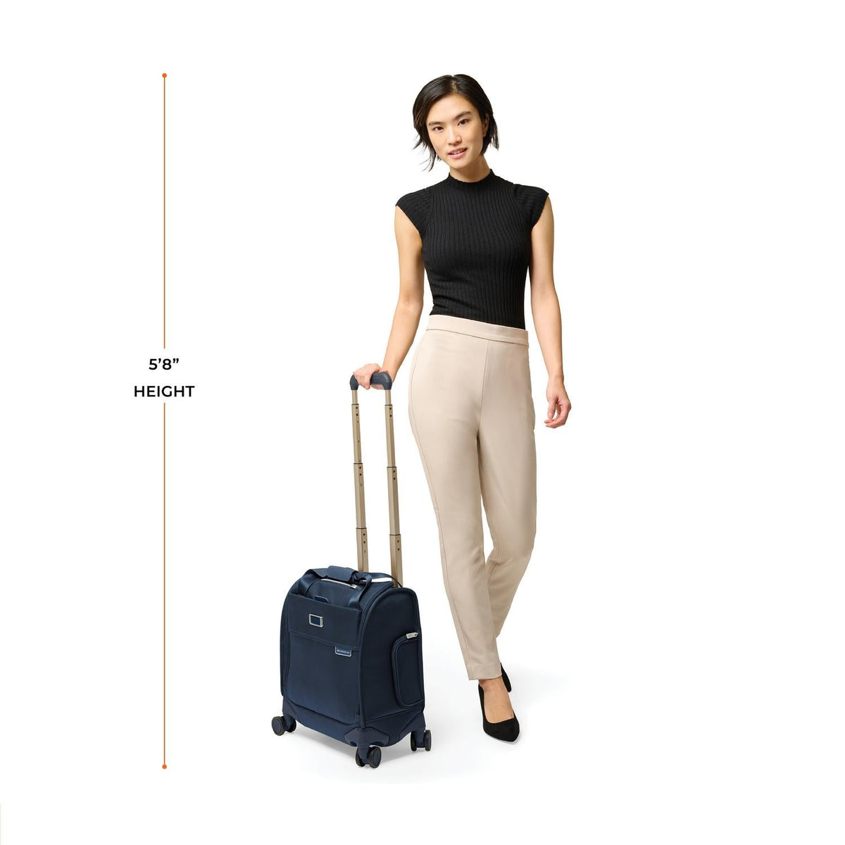 Briggs & Riley Baseline Cabin Spinner in Navy — lifestyle