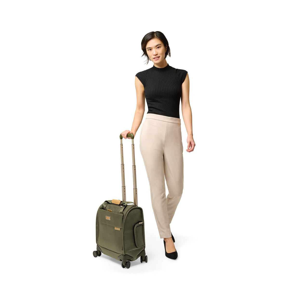 Briggs & Riley Baseline Cabin Spinner in Olive — lifestyle