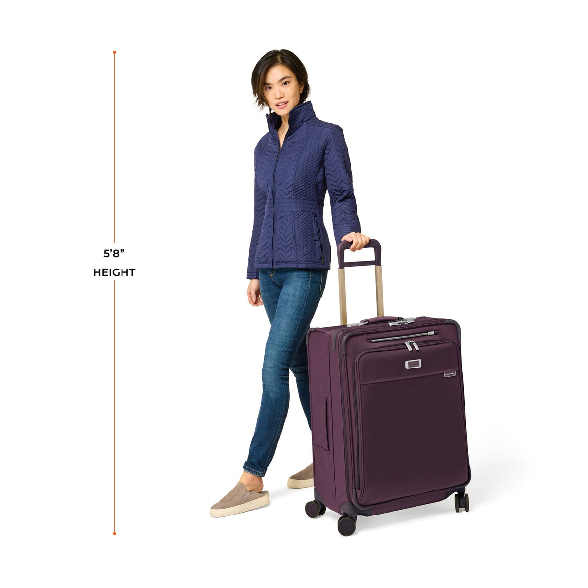 Briggs & Riley Baseline Medium Expandable Spinner in Plum — lifestyle