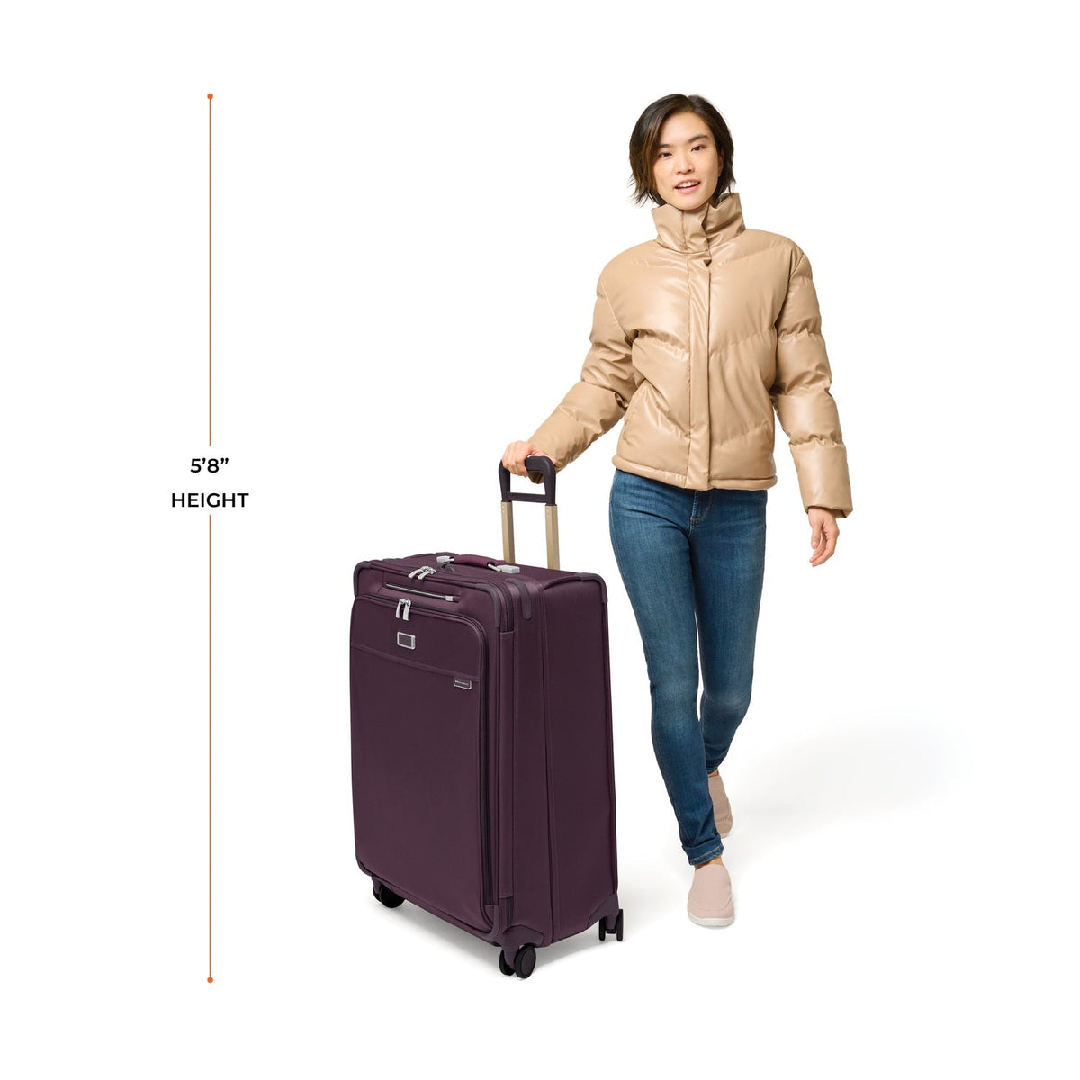 Briggs & Riley Baseline Large Expandable Spinner in Plum — lifestyle