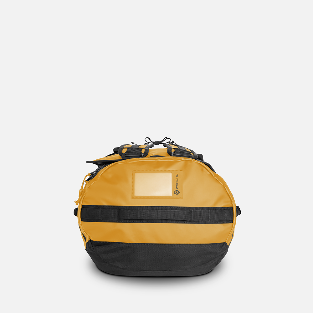 WANDRD CARRYALL Duffel 30L in Dallol Yellow — angle view 3
