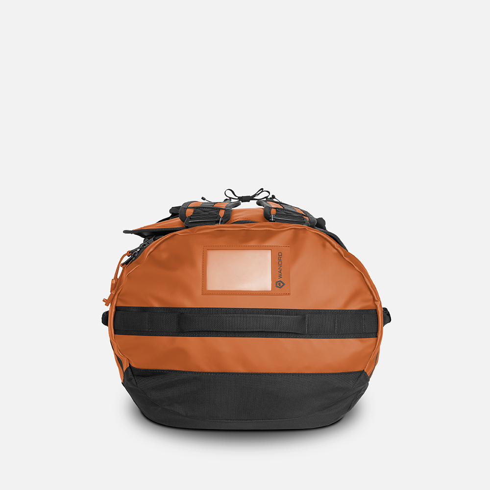 WANDRD CARRYALL Duffel 60L in Sedona Orange — angle view 3
