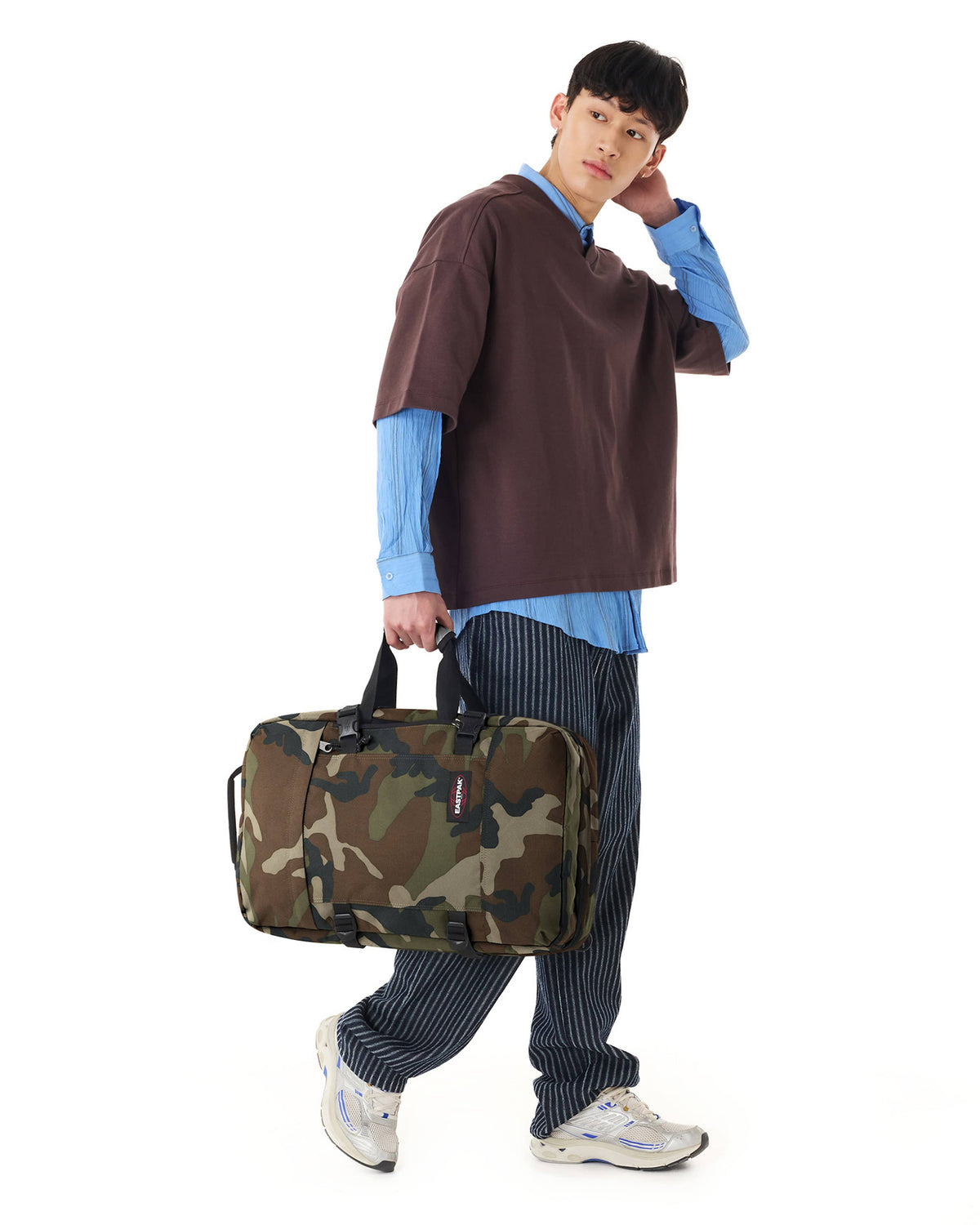 Eastpak Travelpack Backpack 42L in Camo — lifestyle