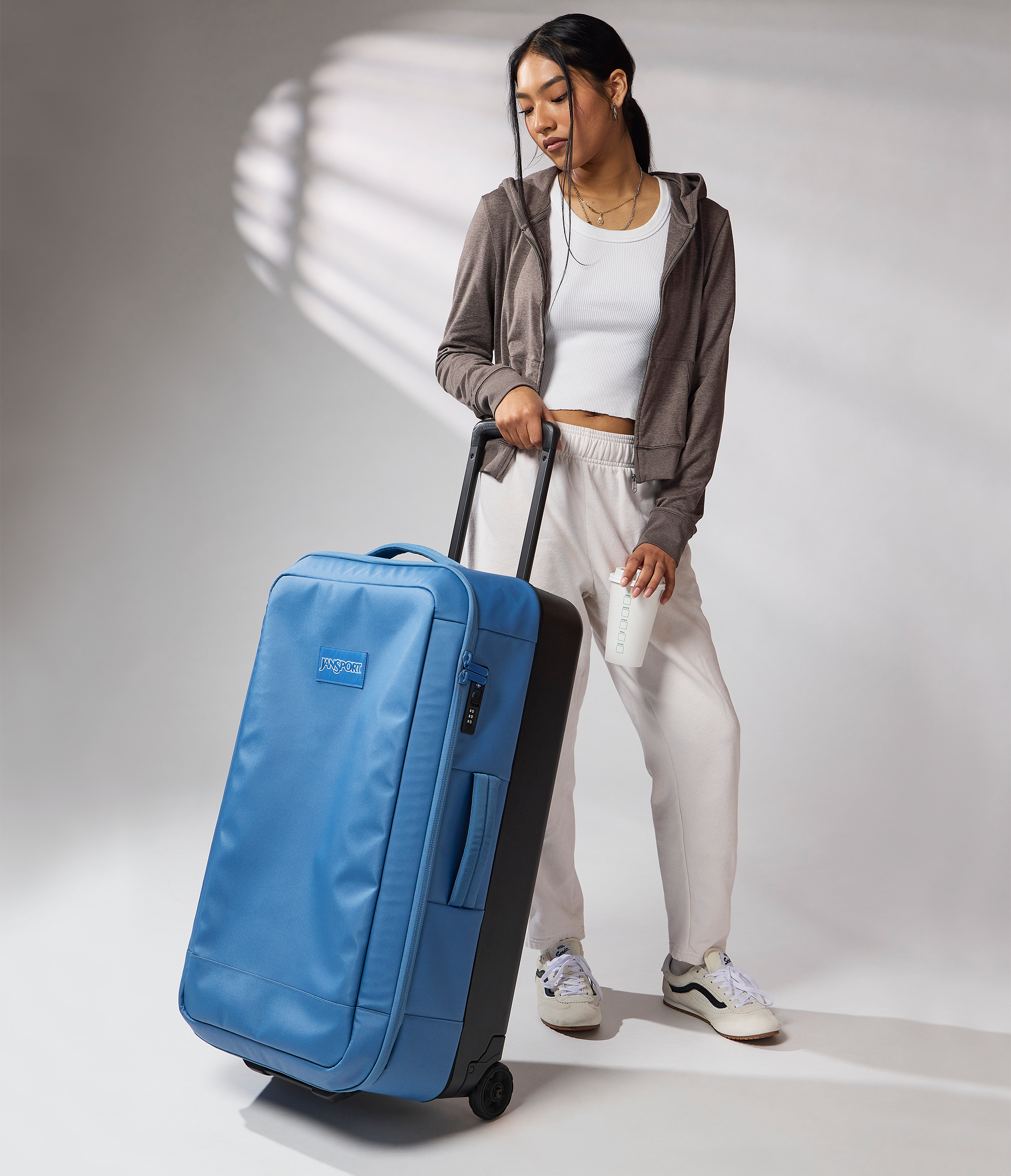 JanSport Good Latitude Wheeled Duffel in Elemental Blue — angle view 2