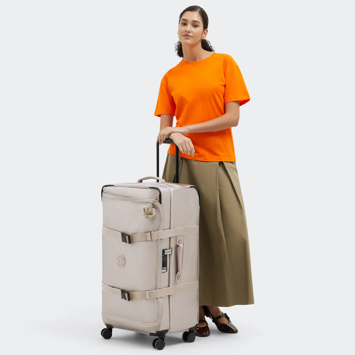 Kipling Spontaneous Large Rolling Luggage in Metallic Glow — lifestyle