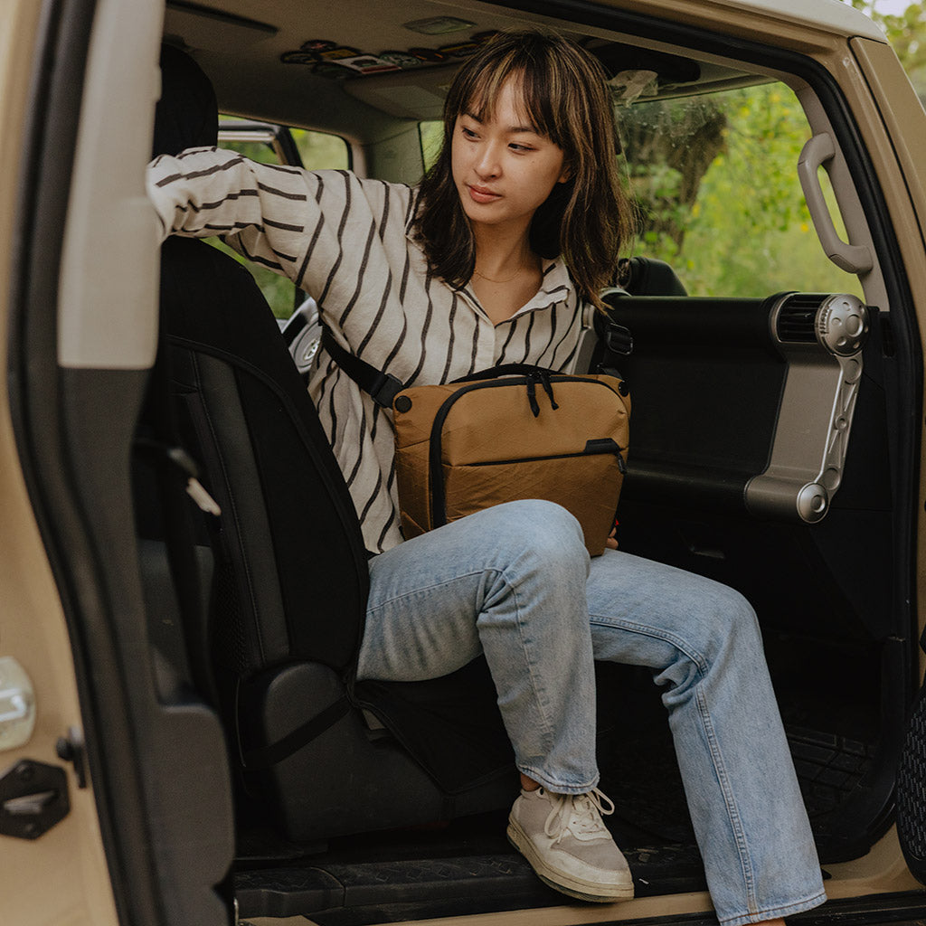 Peak Design Everyday Sling 6L in Coyote — lifestyle