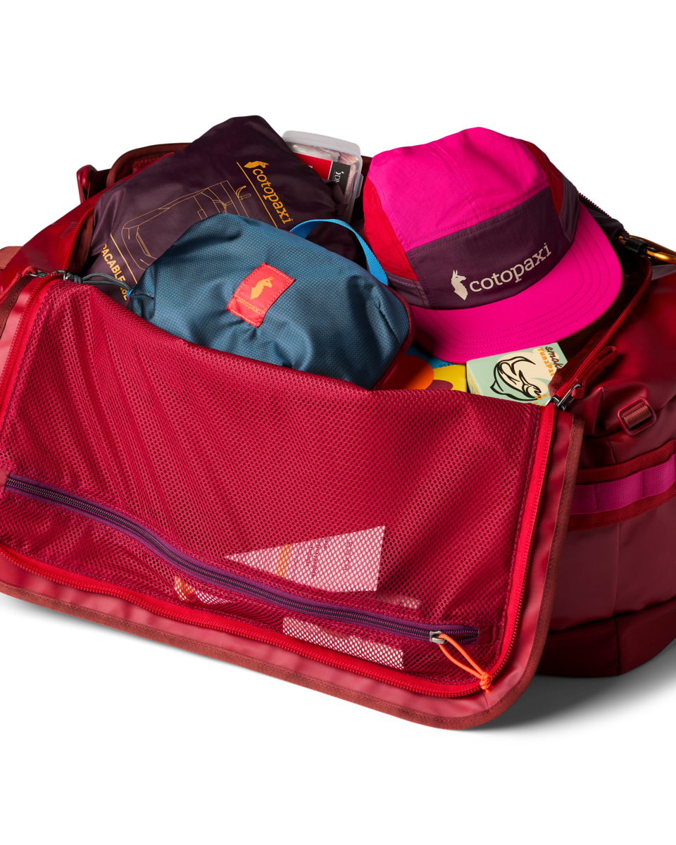 Cotopaxi Allpa Getaway 55L Duffel in Crimson — detail view