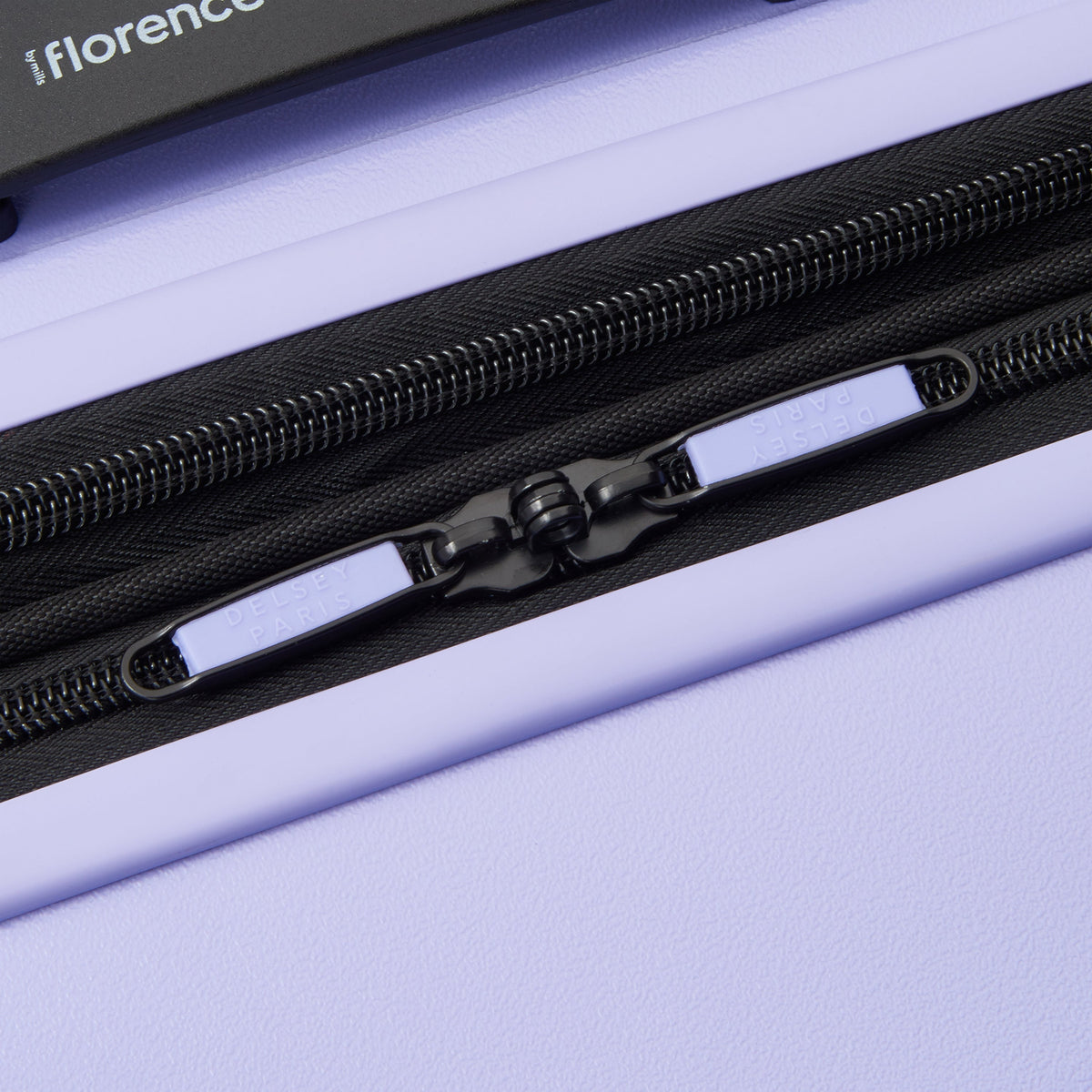 Delsey Catch Flights Carry-On Plus Expandable Spinner in Lavender — detail view