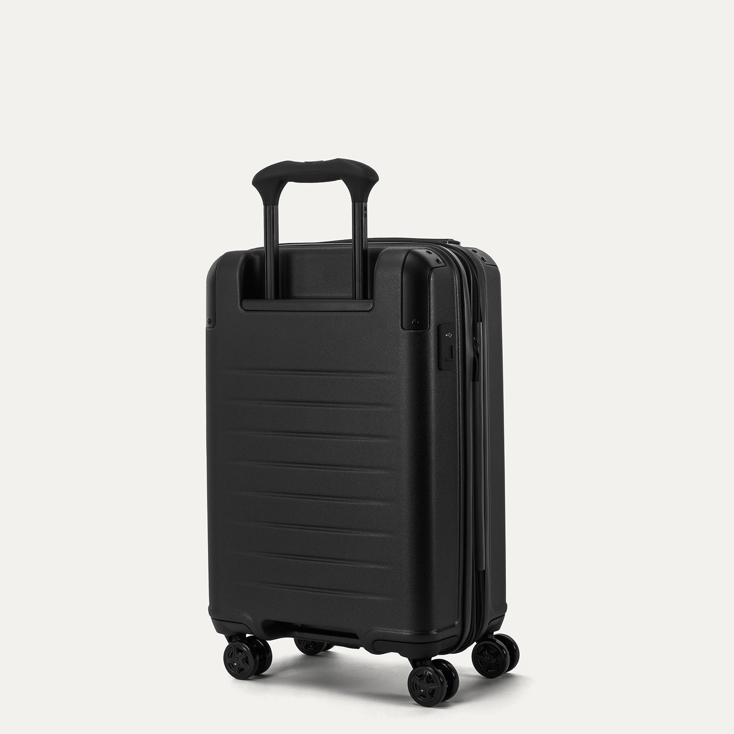 Travelpro Platinum Elite Hardside Compact Carry-On Expandable Spinner in Jet Black — back view