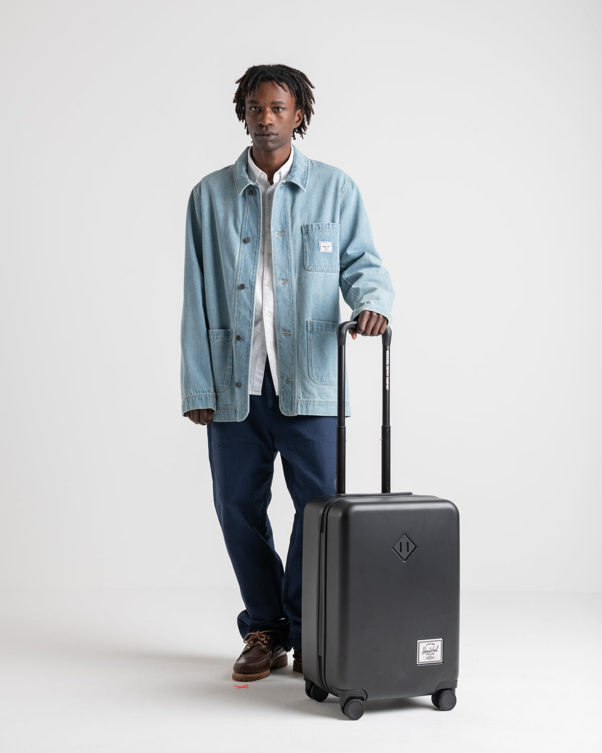 Herschel Heritage Hardshell Large Carry On Luggage 43L in Black — lifestyle # color_Black