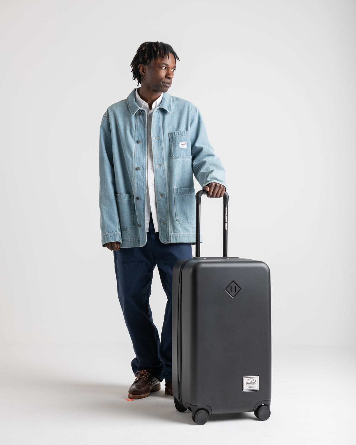 Herschel Heritage Hardshell Medium Luggage 67L in Black — lifestyle # color_Black