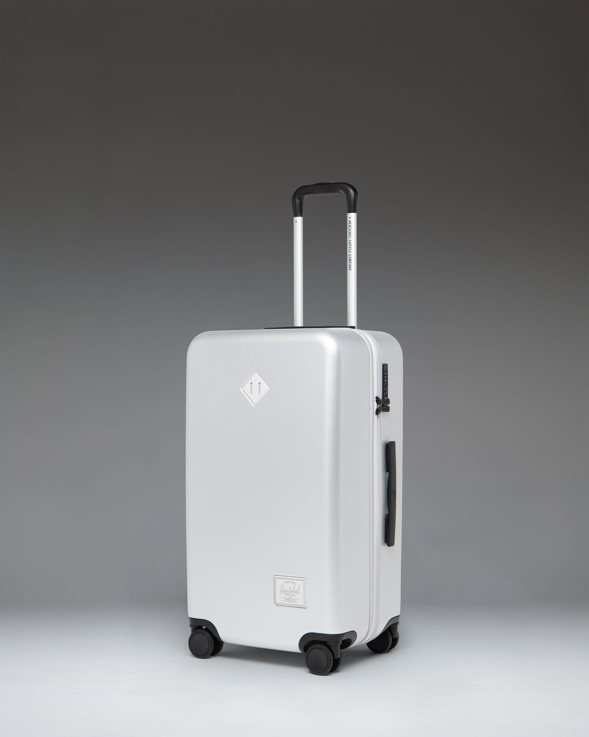 Herschel Heritage Hardshell Medium Luggage 67L in Silver — angle view
