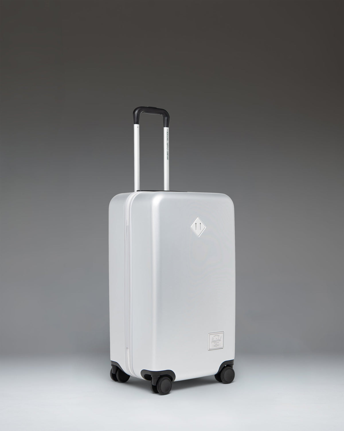 Herschel Heritage Hardshell Medium Luggage 67L in Silver — angle view 2