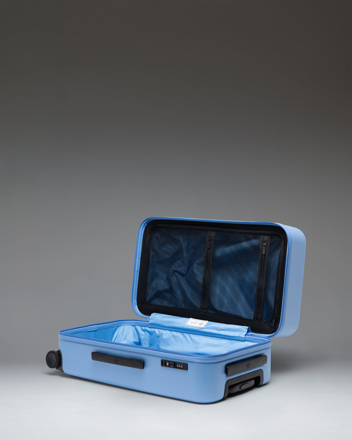 Herschel Heritage Hardshell Medium Luggage 67L in Light Blue — interior view