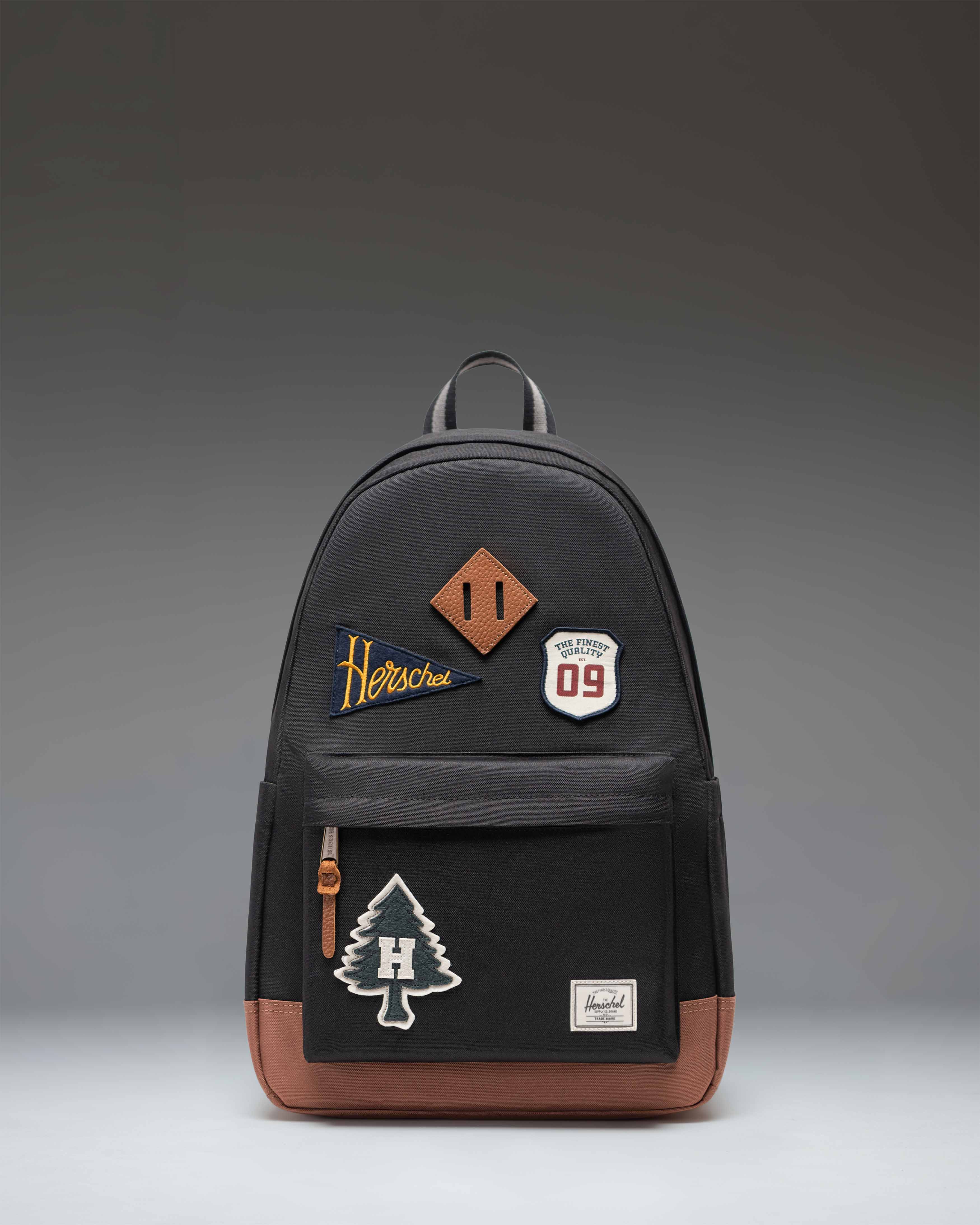 Herschel Heritage Backpack 24L in Patches Black — front view # color_Patches Black