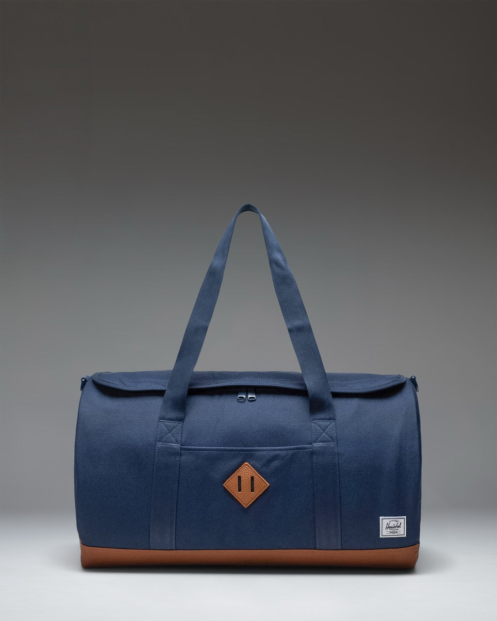 Herschel Heritage Duffle 40L in Navy/Saddle brown — front view