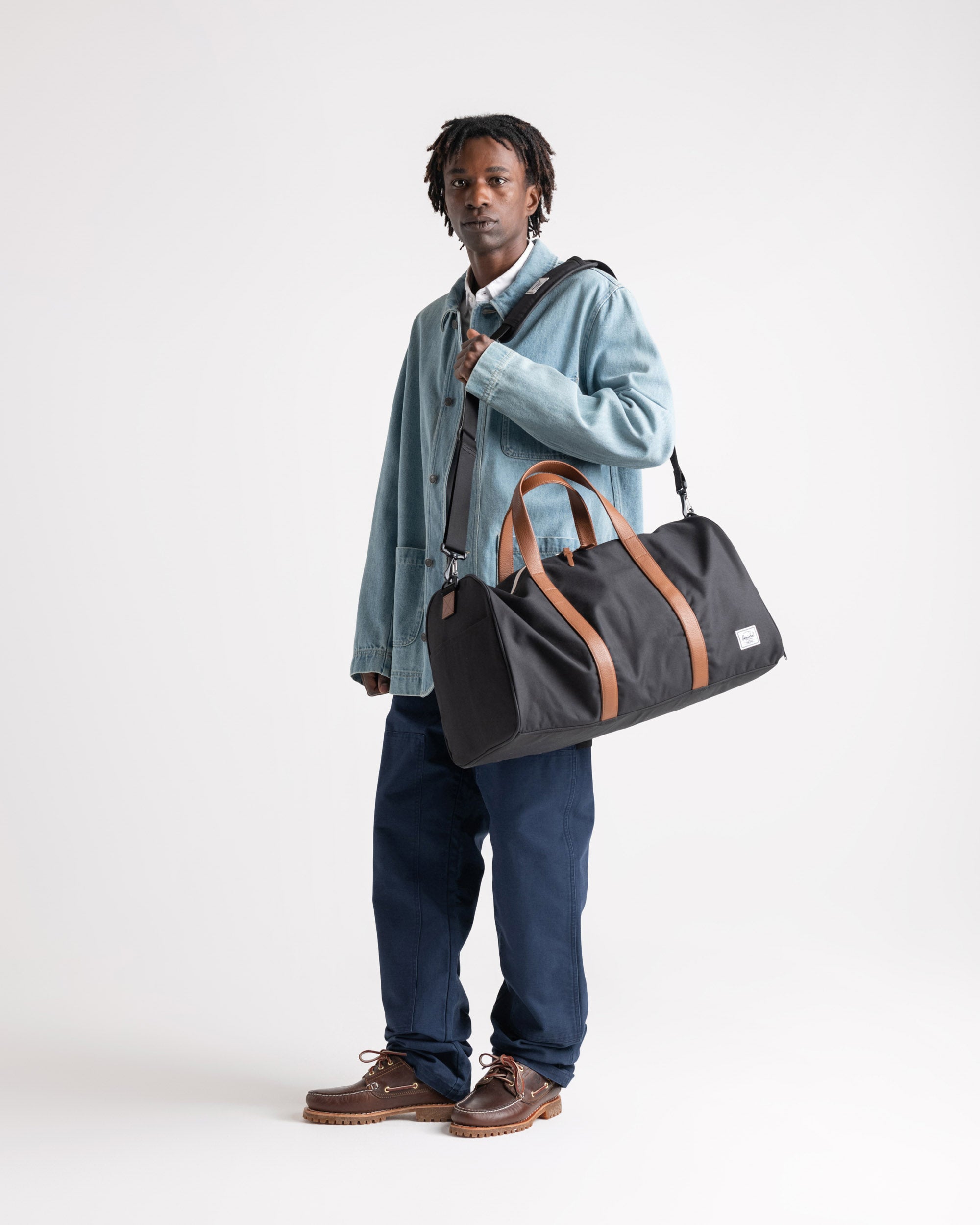 Herschel Novel Duffle 43L in Black — lifestyle # color_Black
