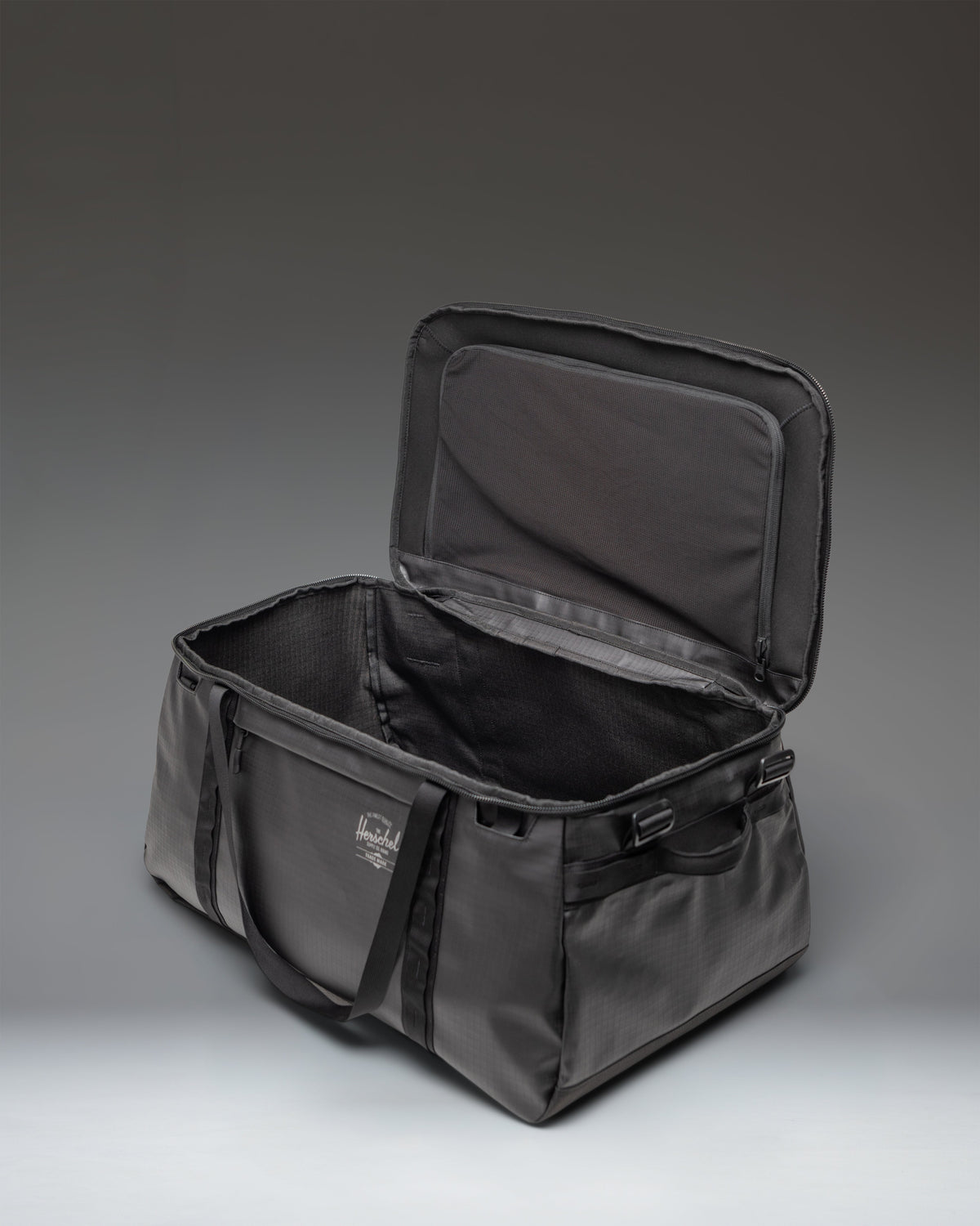 Herschel All Season Duffle 66L in Black — interior view