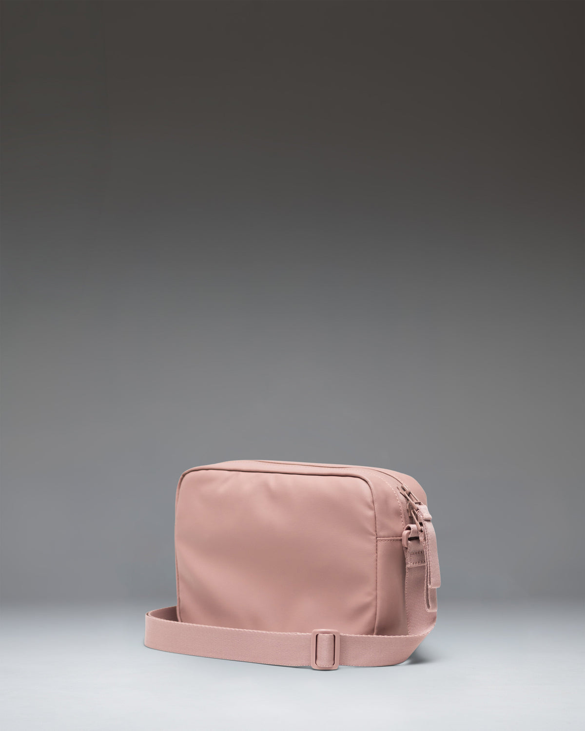 Herschel Alberni Crossbody Weather Resistant 3L in Ash Rose — angle view 2 # color_Ash Rose