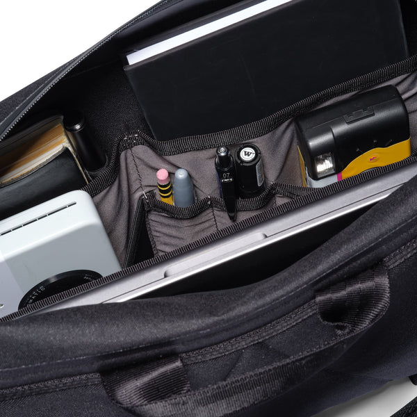 Chrome Industries Kadet Max WP 15L sling bag – black colorway, open showing the main compartment