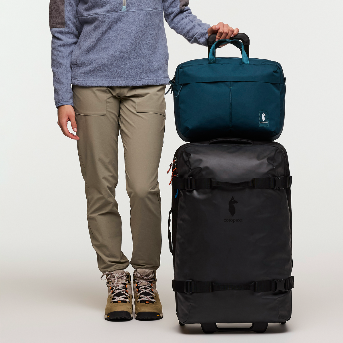 Cotopaxi Allpa 65L Roller Bag in Black — lifestyle
