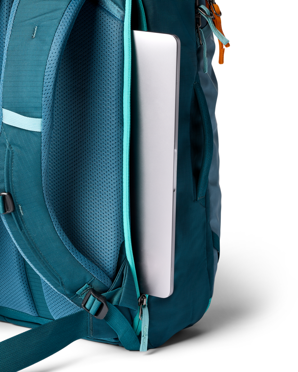 Cotopaxi Allpa 28L Travel Pack in Blue Spruce/Abyss — angle view 1
